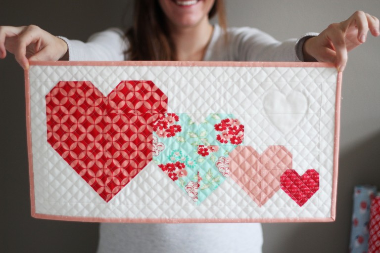 "I Heart You Mini Quilt" is a Free Valentine's Day Quilted Project Pattern designed by Allison from Cluck Cluck Sew!